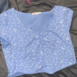 A cute baby blue floral crop top